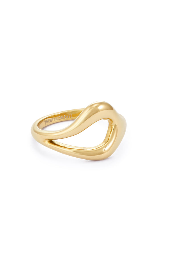 Gold ring with a unique, open, teardrop-shaped design in the center, resting on a white background Bague Gia - Or