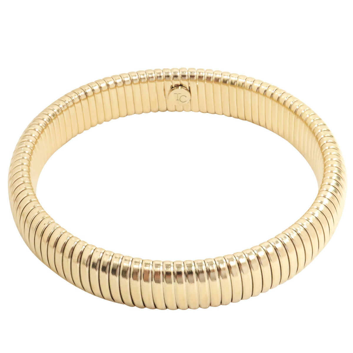 Gold Riba Bracelet: A thick, gold-toned bracelet with a ribbed, flexible design Riba Bracelet - Gold