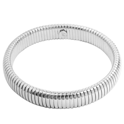 Silver Riba Bracelet: A thick, silver-toned bracelet with a ribbed, flexible design