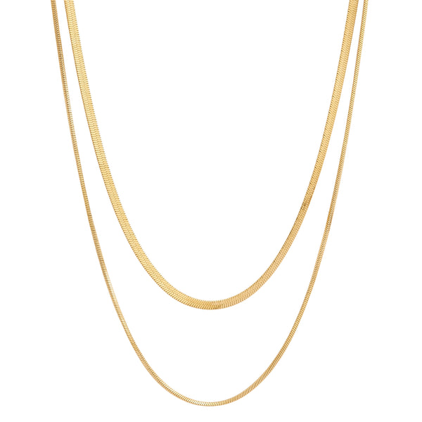 Two gold herringbone chain necklaces, one slightly longer than the other, laid vertically against a white background Collier Serenade - Or