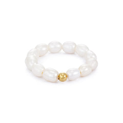 A white pearl ring with a gold-plated stainless steel bead in the center, displayed against a plain background.
