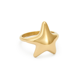 Gold starfish ring with a smooth, polished finish, isolated on a white background.