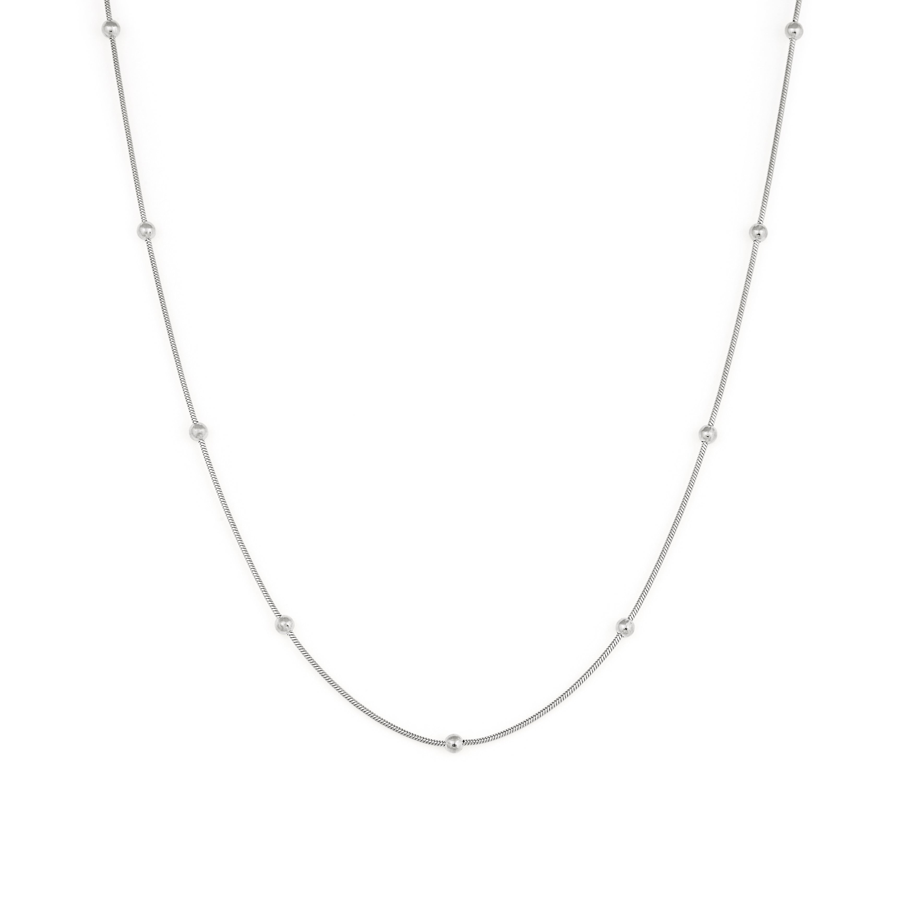 A silver necklace with a chain link design and small spherical embellishments evenly spaced along the length.