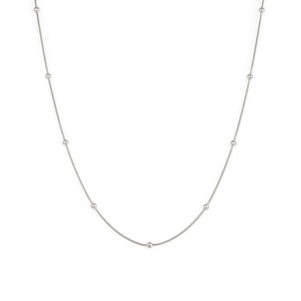A silver necklace with a chain link design and small spherical embellishments evenly spaced along the length. Aura Necklace - Silver