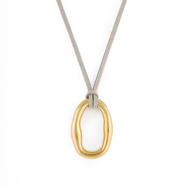 A gold-colored necklace with an organic shaped pendant and a gray vegan suede cord. Dolce Necklace - Gold
