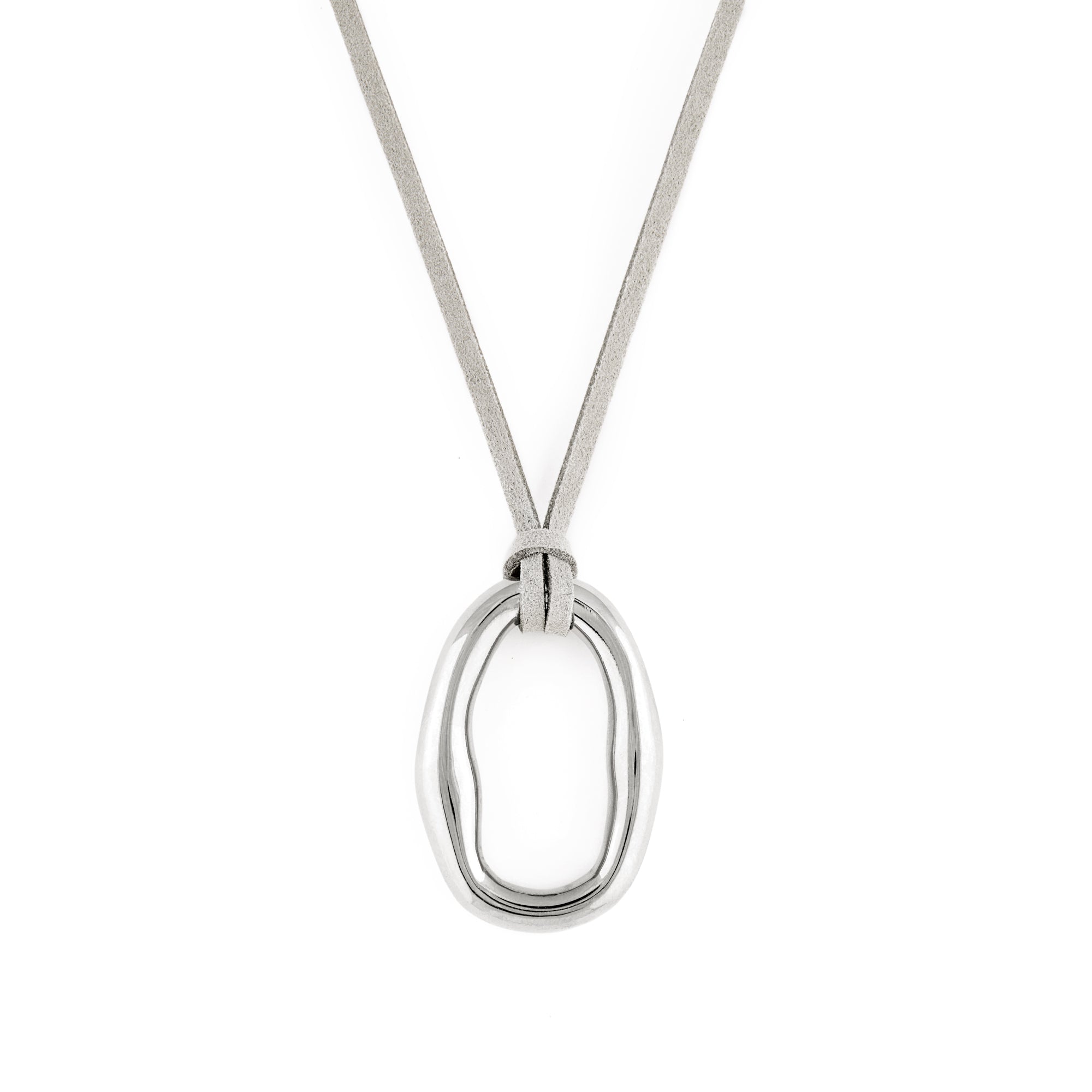 A silver-colored necklace with an organic shaped pendant and a soft vegan suede cord.