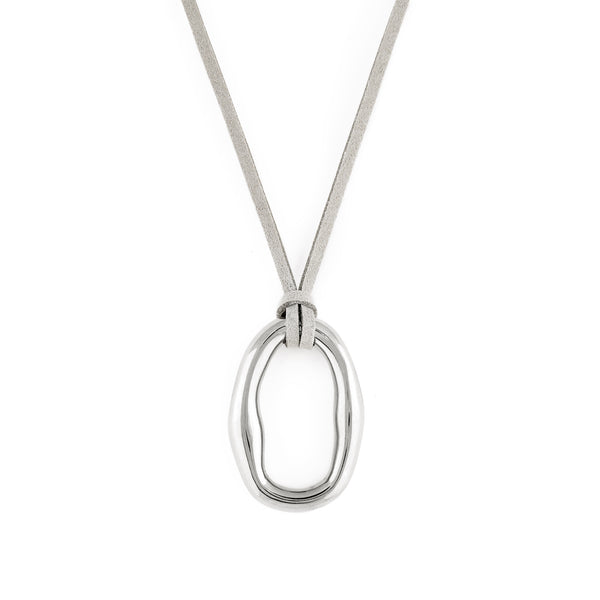 A silver-colored necklace with an organic shaped pendant and a soft vegan suede cord. Dolce Necklace - Silver