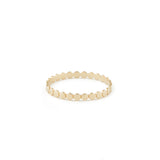 A gold ring with a uniform dotted finish.