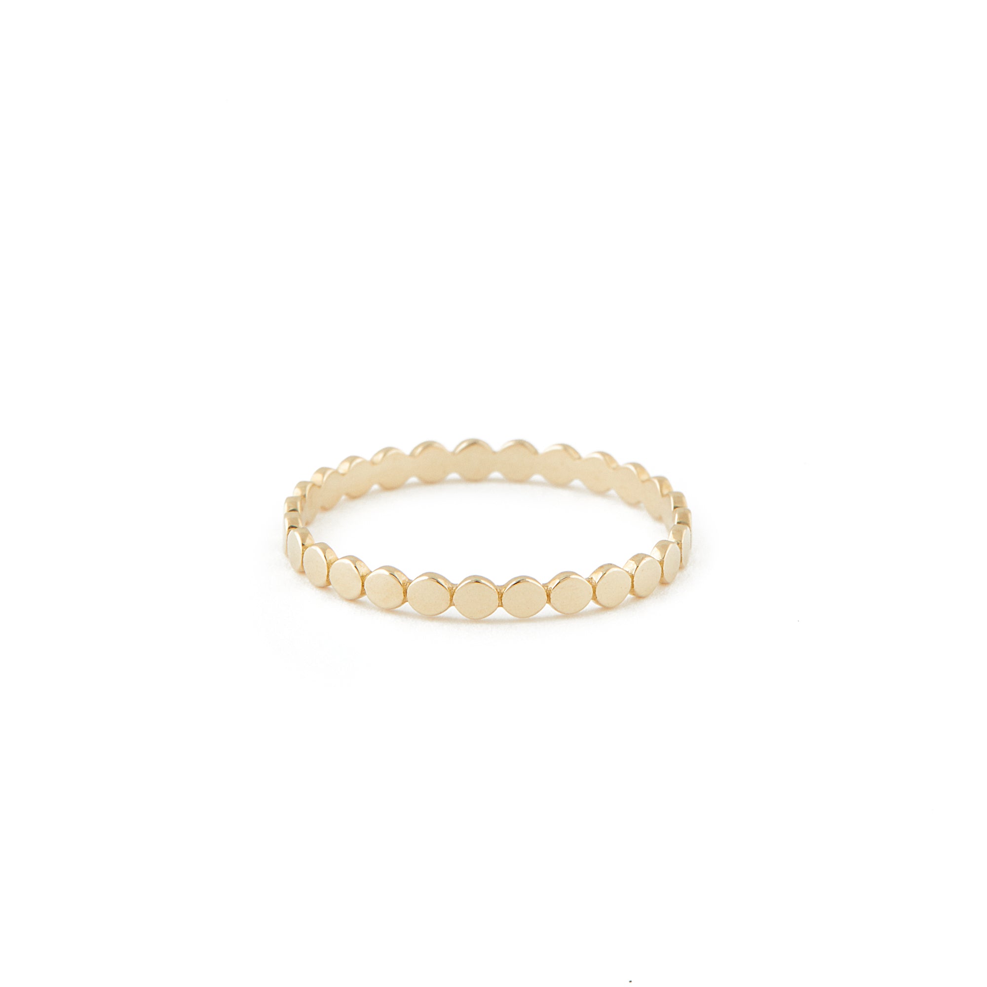 A gold ring with a uniform dotted finish.
