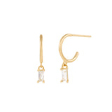 The Alaska Earrings by Twenty Compass are gold vermeil hoops featuring rectangular cubic zirconia pendants for a minimalist look.