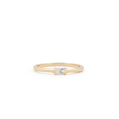 A simple, elegant Alaska Ring by Twenty Compass, made of gold vermeil with a small rectangular diamond in the center, is displayed on a plain white background, showcasing its understated charm.